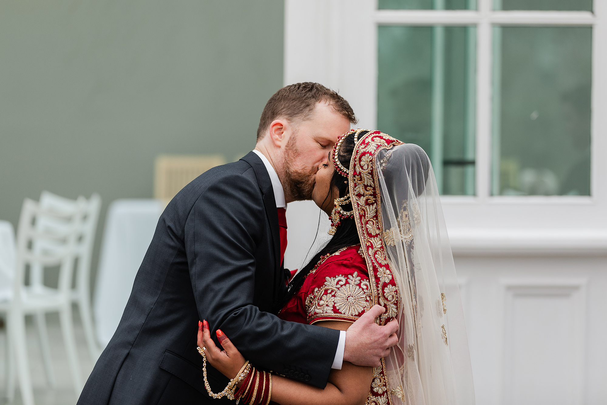bride and groom kiss at the ceremony